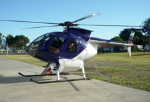 Load image into Gallery viewer, MD500 spray system on helicopter - on tarmac
